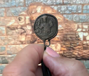 1143-1180 AD Byzantine Emperor Manuel I Komnenos holds cross supported by globe left and military standard_right Greek Chi Rho, or X and P for CHRIST &ndash; OBVERSE bronze coin